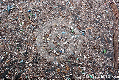 Floating plastic pollution in a dam Stock Photo