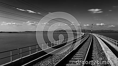 Floating Railway on Pasak Chonlasit Dam in Lopburi, Thailand in black and white Stock Photo