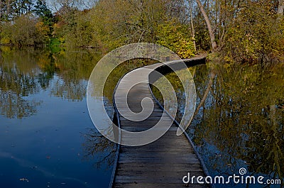 floating walkway made of wooden planks. narrow curved paths Stock Photo