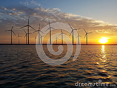 Floating wind farm at dusk Stock Photo