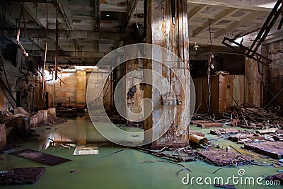 Flooded collapsed basement of abandoned industrial building Stock Photo