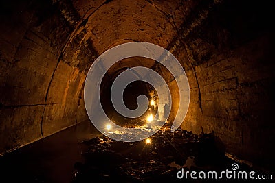 Flooded by dirty industrial wastewater sewage collector. Sewer tunnel under city full of garbage Stock Photo