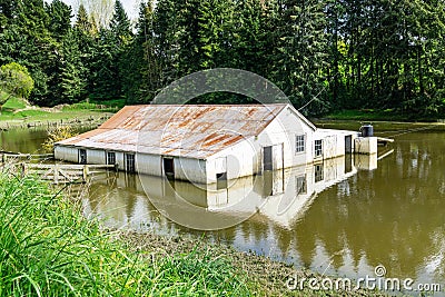 Flooded farm building Stock Photo