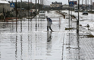 A flooded street during a rainy day in the town of Deir Al-Balah in the central Gaza Strip Editorial Stock Photo