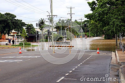 flooded street with a sign that says flood busters on the road Stock Photo