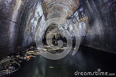 Flooded by wastewater sewage collector of underground river Stock Photo