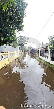 Flooding that inundated the road village Stock Photo