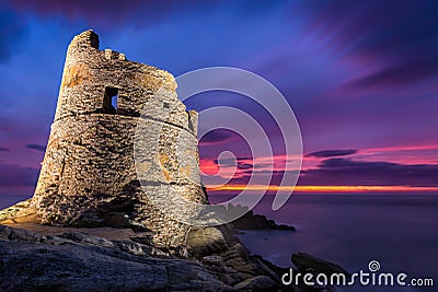 Floodlit Genoese tower at Erbalunga in Corsica at sunrise Stock Photo