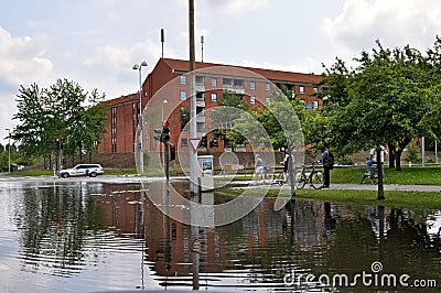 Water flooded road and street in Copenhagen, Denmark. Traffic complications. Editorial Stock Photo