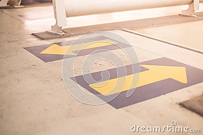 Floor detail with arrows. Concept of signals of new normal with social distancing on public place Stock Photo