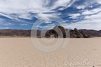 Floor of a dry lake with cracked mud Stock Photo