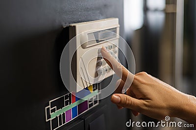 Floor plan and switching lighting. The woman pressed the button. Stock Photo