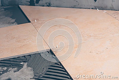 Floor tiles close-up, large square tiles made of porcelain tiles Stock Photo