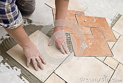 Floor tiles installation Stock Photo