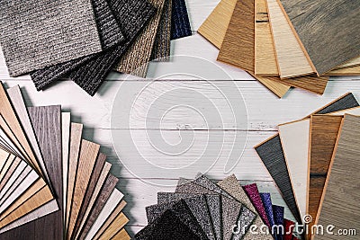 Flooring and furniture materials - floor carpet and wooden laminate samples with copy space Stock Photo