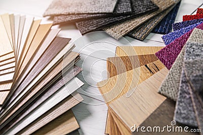 Flooring and furniture materials - floor carpet and wooden laminate samples Stock Photo