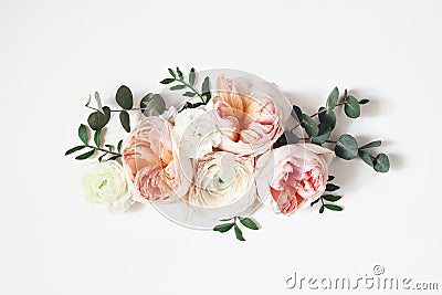 Floral arrangement, web banner with pink English roses, ranunculus, carnation flowers and green leaves on white table Stock Photo