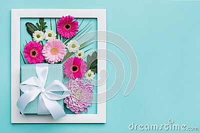 Floral flat lay minimal concept with beautifully wrapped present. Happy Mother`s Day. Stock Photo