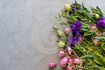 Floral flatlay. Pink ranunculus and purple lisianthus Stock Photo