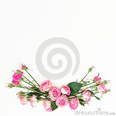 Floral frame made of roses flowers with copy space. Spring composition with pink roses on white background. Top view. Flat lay. Stock Photo