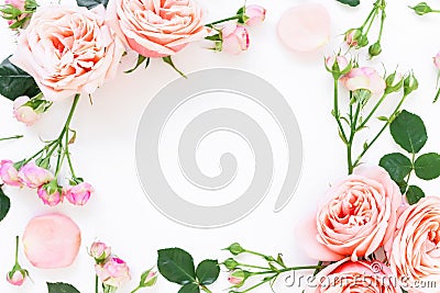 Floral frame of peony roses, buds and leaves on white background. Flat lay, top view. Floral background. Stock Photo