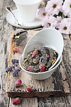 Floral herbal tea on a wooden table. Stock Photo