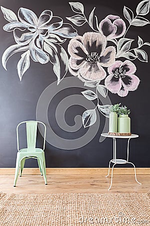 Floral motif on blackboard wall Stock Photo