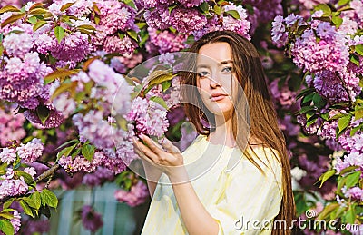 Floral paradise. Floral shop. Girl in cherry blossom flower. Sakura tree blooming. Soft and tender. Gorgeous flower and Stock Photo