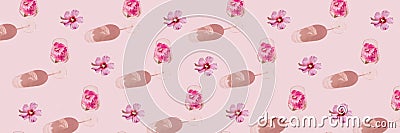 Floral pattern banner made of glass with hibiscus flower water on pastel pink background. Minimal style. Summer refreshment Stock Photo