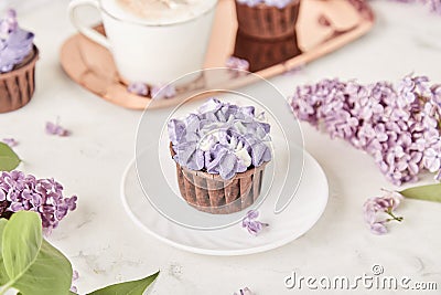 Floral purple cake in trending Dreamy Escapism. Leisure and relax coffee time. Spring purple background. Beautiful food Stock Photo