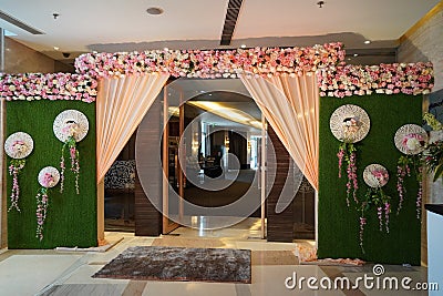 Floral Wedding decoration element. Lights, entrance gate, Shower, Flowers, Couple Stage. Closeup beautiful flowers wedding arch at Editorial Stock Photo