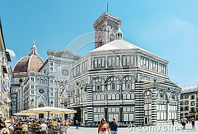 Florence, Italy - August 25, 2020: Piazza Duomo, baptistery in the foreground and the cathedral in the background. On the square Editorial Stock Photo