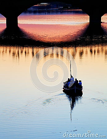 FLORENCE, ITALY, 10 AUGUST 2020: Touristic boats on Arno River near Ponte Vecchio, seen from the Ponte Santa Trinita in Florence. Editorial Stock Photo