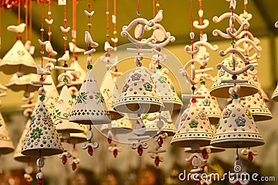 Florence, ITALY - DECEMBER 2018: small decorated bells hanging from the roof at the Christmas market Editorial Stock Photo