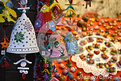 Florence, ITALY - DECEMBER 2018: small decorated bells hanging from the roof at the Christmas market Editorial Stock Photo