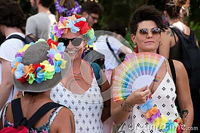 Unidentified participant with symbols of the rainbow during the Toscana Pride LGBTQ parade. Editorial Stock Photo