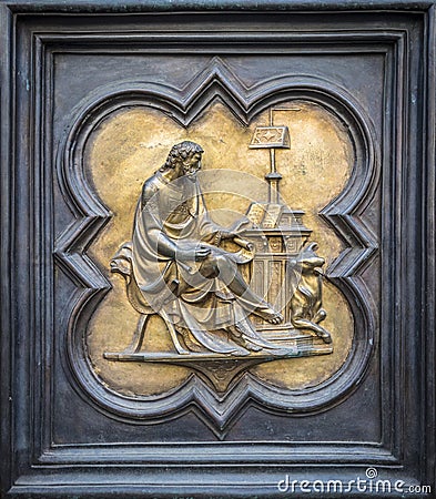 FLORENCE, ITALY - OCTOBER 7, 2018: The fragment of copy of North Doors of the Baptistery of San Giovanni, by Lorenzo Ghiberti Editorial Stock Photo