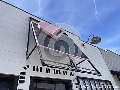 Florida Ave vintage sign on a building with a pink piano Editorial Stock Photo