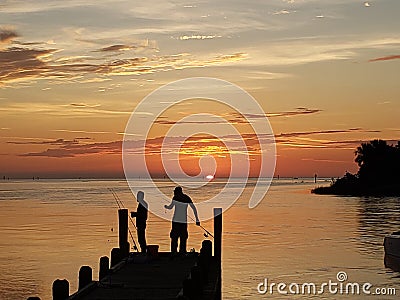 Florida gulf coast sunset fishing pier Stock Photo