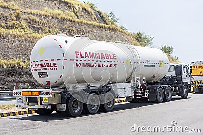 Floridablanca, Pampanga, Philippines - A tanker or fuel truck is parked by a rest stop at a highway Editorial Stock Photo