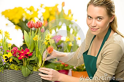 Florist arrange spring flowers colorful plants Stock Photo