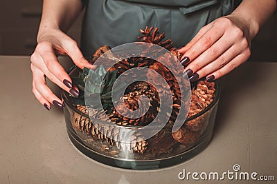 Florist creating christmas decoration closeup Stock Photo