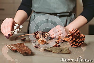 Florist creating christmas decoration closeup Stock Photo