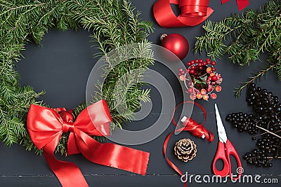 Florist hands making Christmas wreath Stock Photo