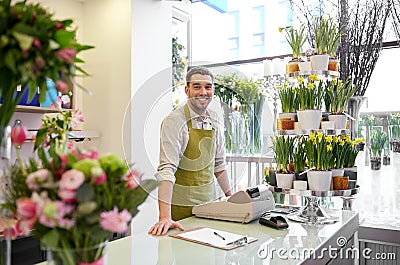 Florist man with clipboard at flower shop counter Stock Photo