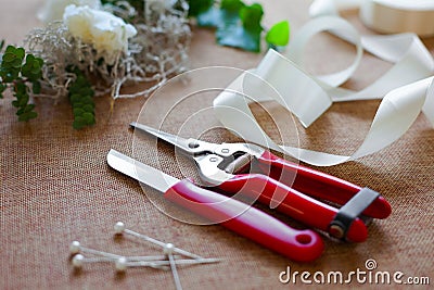 Florist workplace. Tools and accessories. Stock Photo