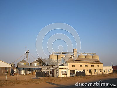 Flour Mill and silos in Africa Vector Illustration