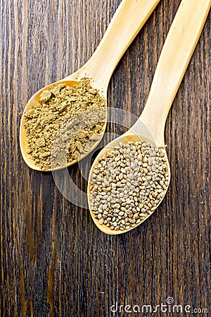 Flour and seed of hemp in wooden spoon on board Stock Photo