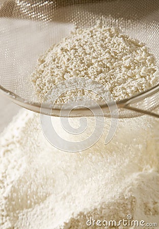 Flour in sieve Stock Photo