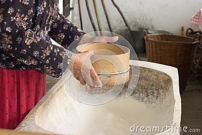 Flour sifting Stock Photo